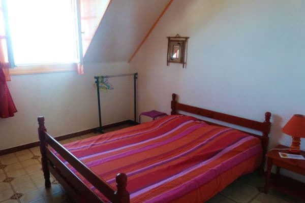 Chambre Frangipanier avec lit double et vue sur la mer